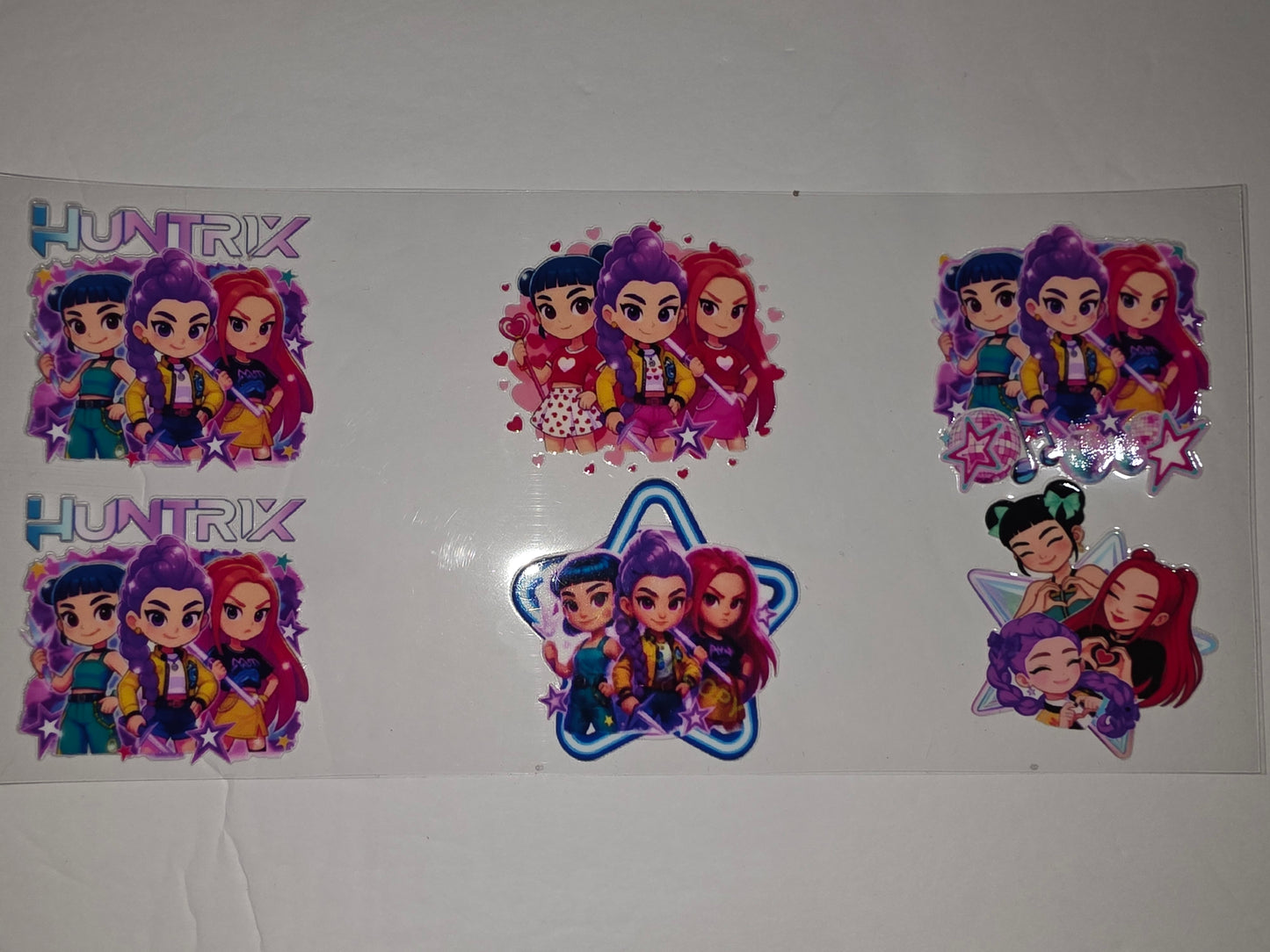 Huntrix Anime Girl Tumbler Wrap - Vibrant Pink, Purple, Blue & Yellow Chibi Characters